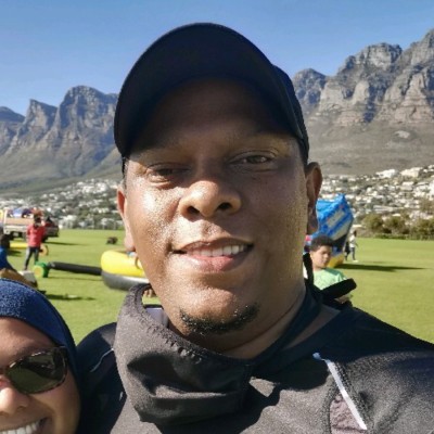 Agmad Kafaar taking a selfie on top of Table Mountain in Cape Town